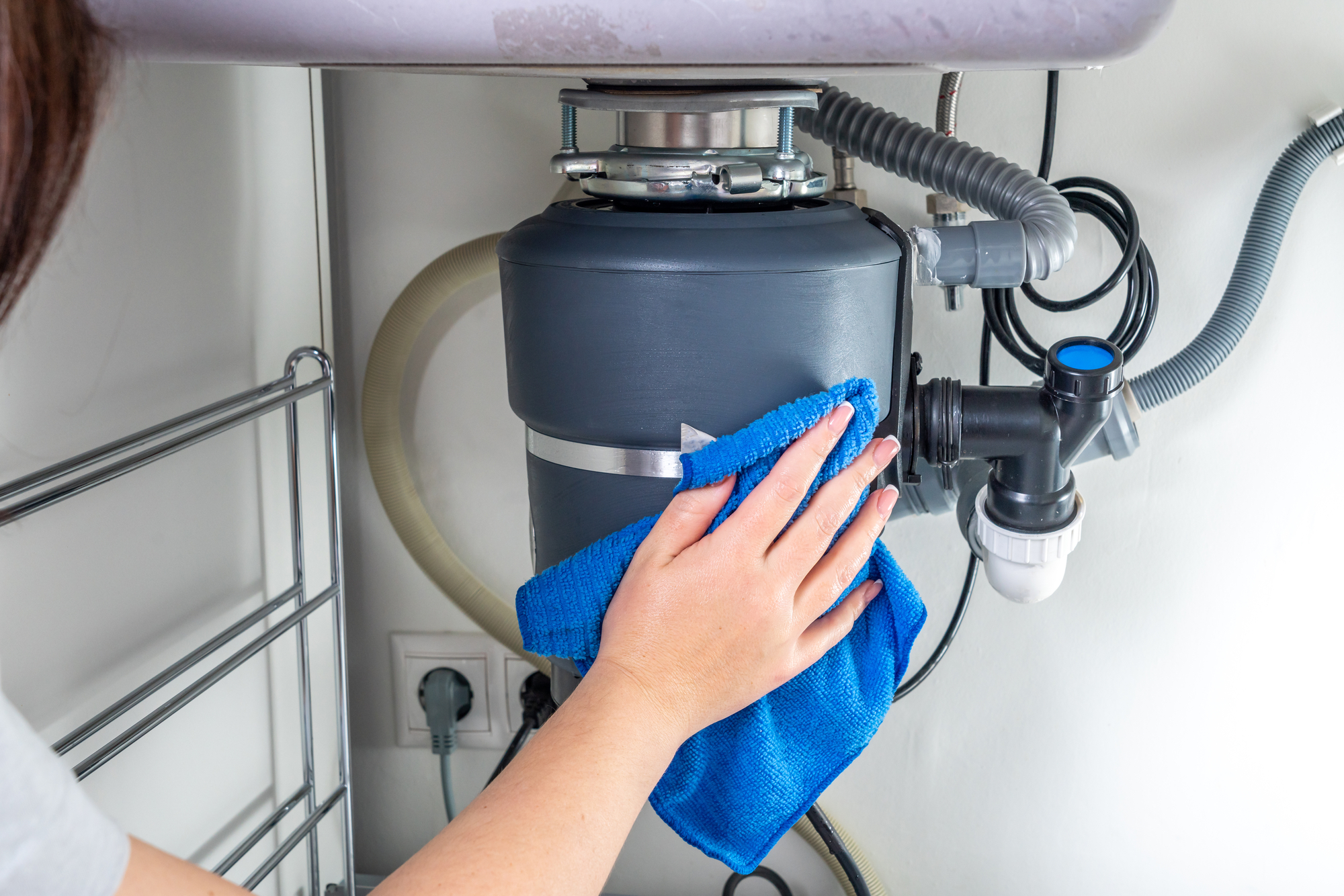 Garbage Disposal under the modern sink, waste chopper concept Garbage Disposal Installation