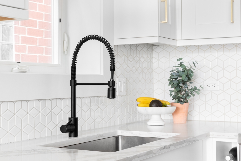 A,Farmhouse,Kitchen,Sink,Detail,Shot,With,A,Black,Faucet, Save Water - Faucet Installation